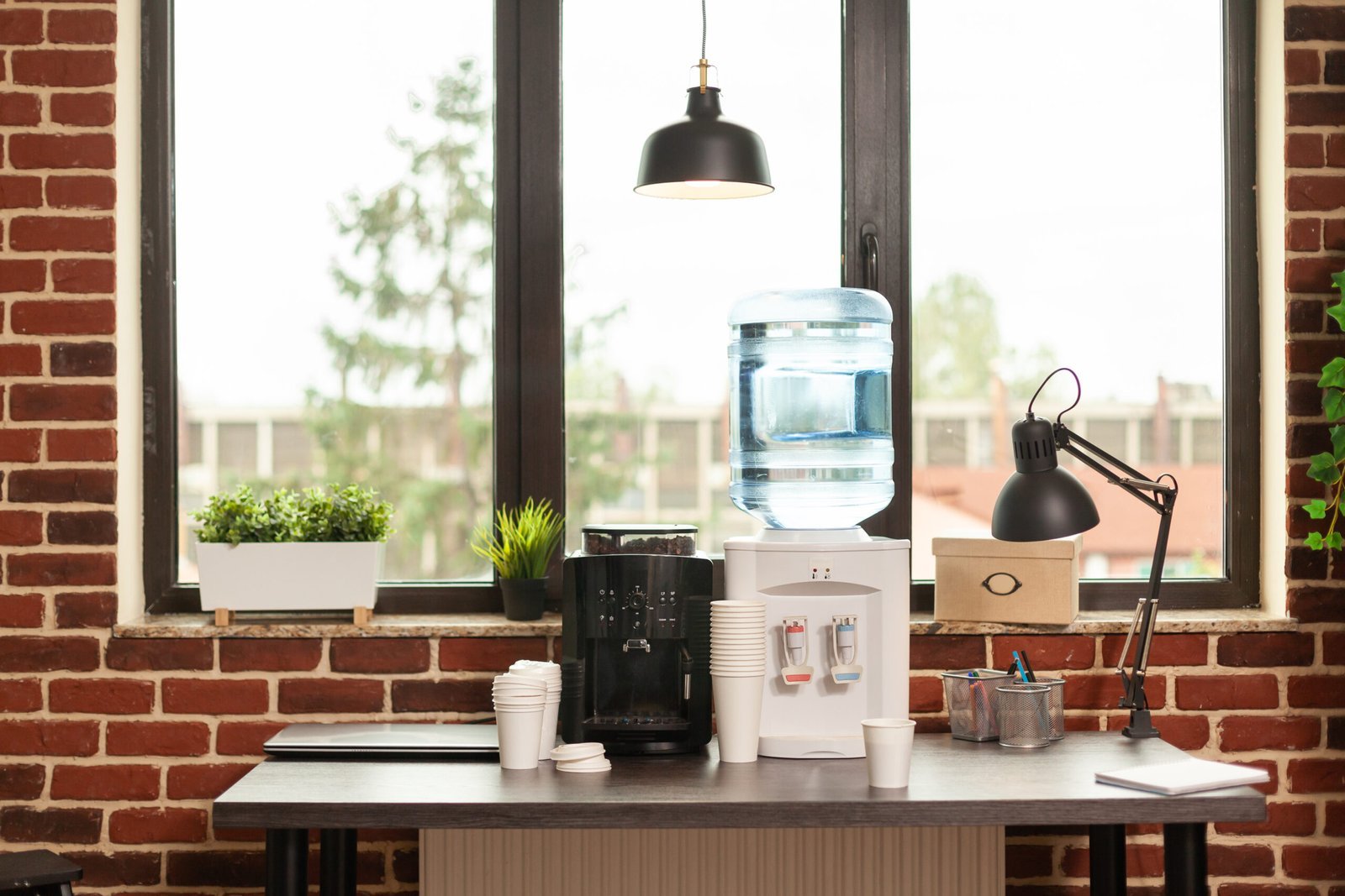 close-up-water-dispenser-coffee-machine-table-meeting-office-liquid-refreshment-people-working-modern-workplace-fresh-beverage-equipment-hydrate-break-scaled.jpg